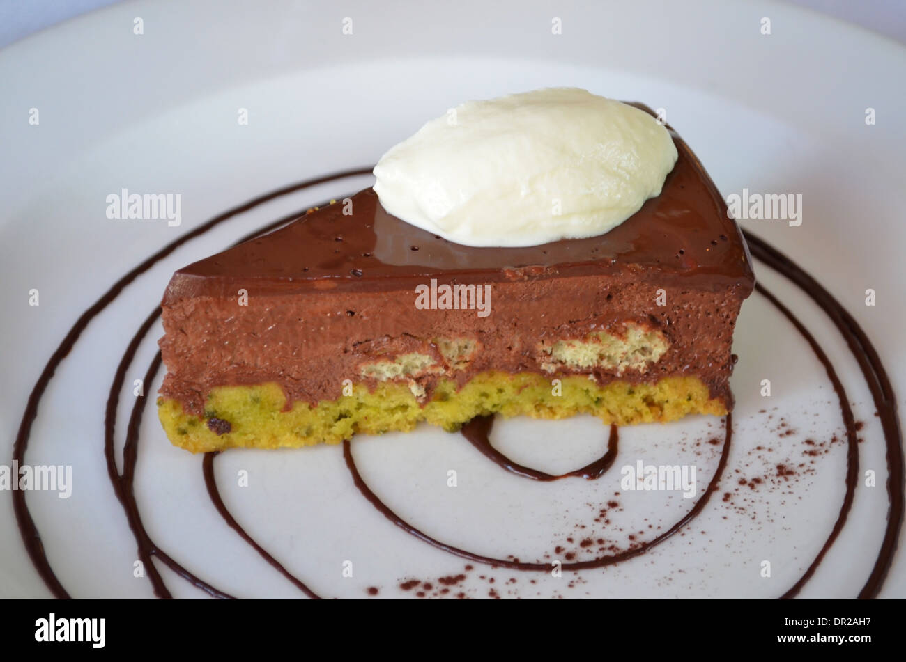 Chocolate delice with pistachio crumble, crème fraiche, served at Bistrot Bruno Loubet, Clerkenwell, London Stock Photo
