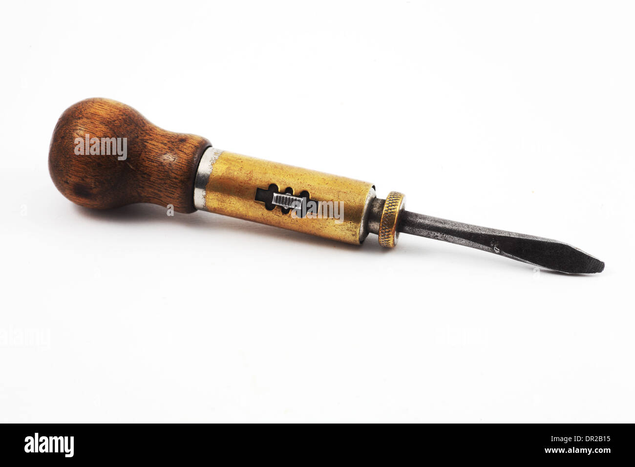vintage old screwdriver with a mechanism on white background Stock Photo