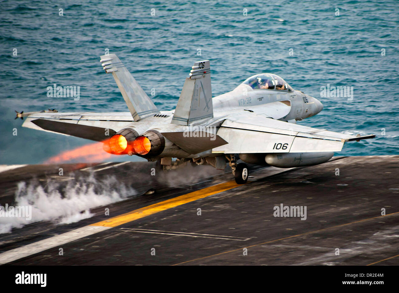A US Navy F/A-18F Super Hornet fighter aircraft launches from the flight deck of the US Navy aircraft carrier USS Harry S. Truman January 15, 2014 in the Arabian Sea. Stock Photo