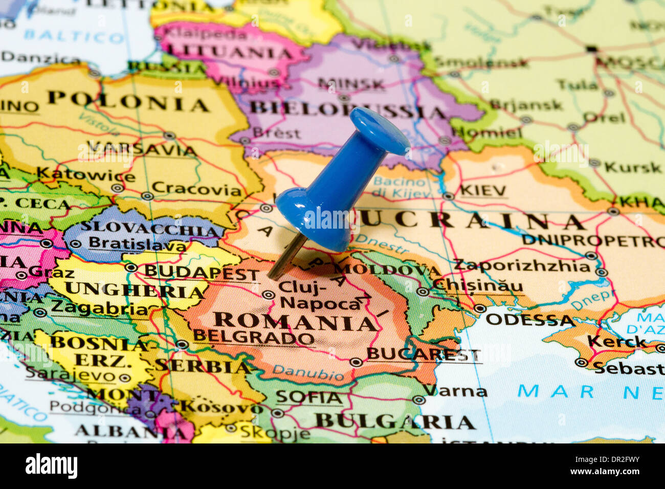 Map of Romania with a blue pushpin stuck Stock Photo