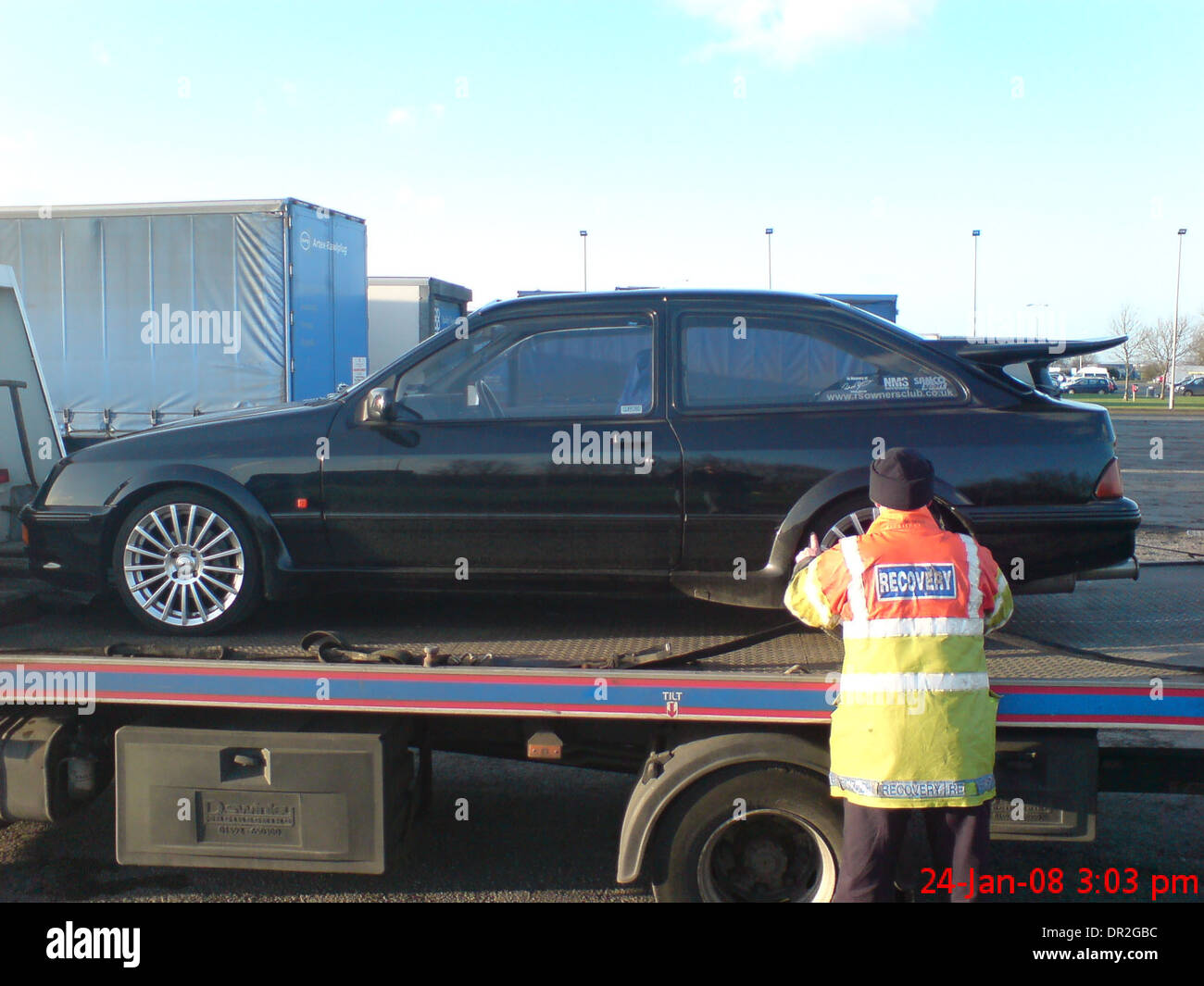 Ford Sierra RS Cosworth Being Loaded onto a Flatbed AA recovery truck mk1 1st generation Stock Photo