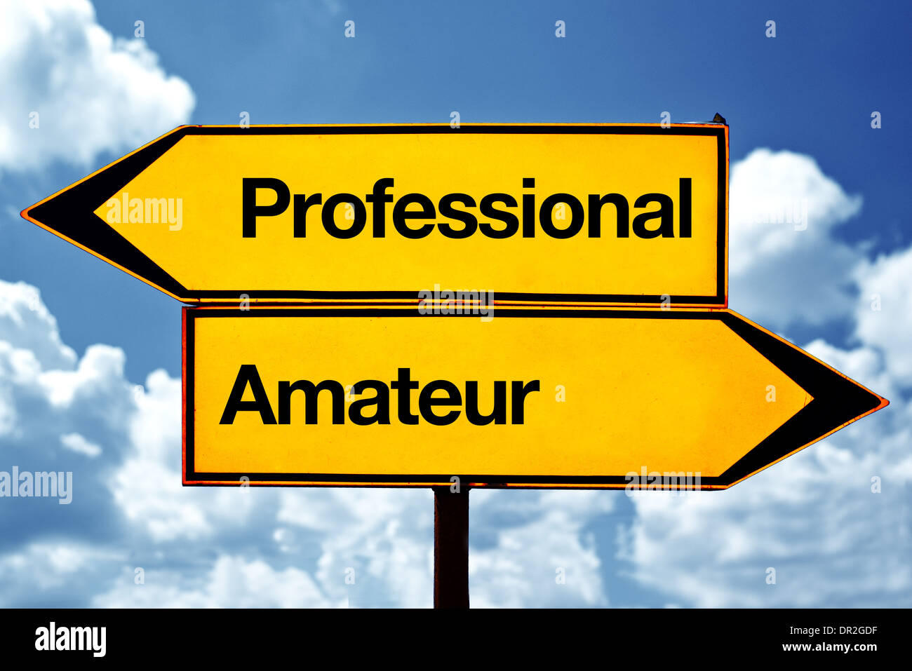 Professional or amateur opposite signs. Two opposite road signs against blue sky background. Stock Photo