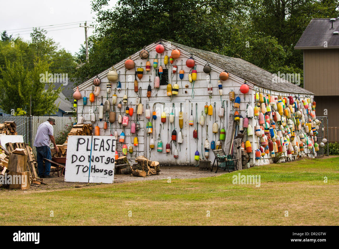 House covered in fishing buoys, Warrenton, Oregon, USA Stock Photo