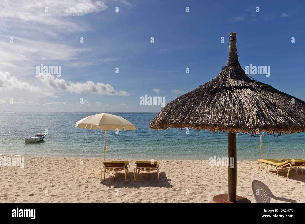 Sun recliners with umbrellas on sandy beach, Mauritius Stock Photo Alamy
