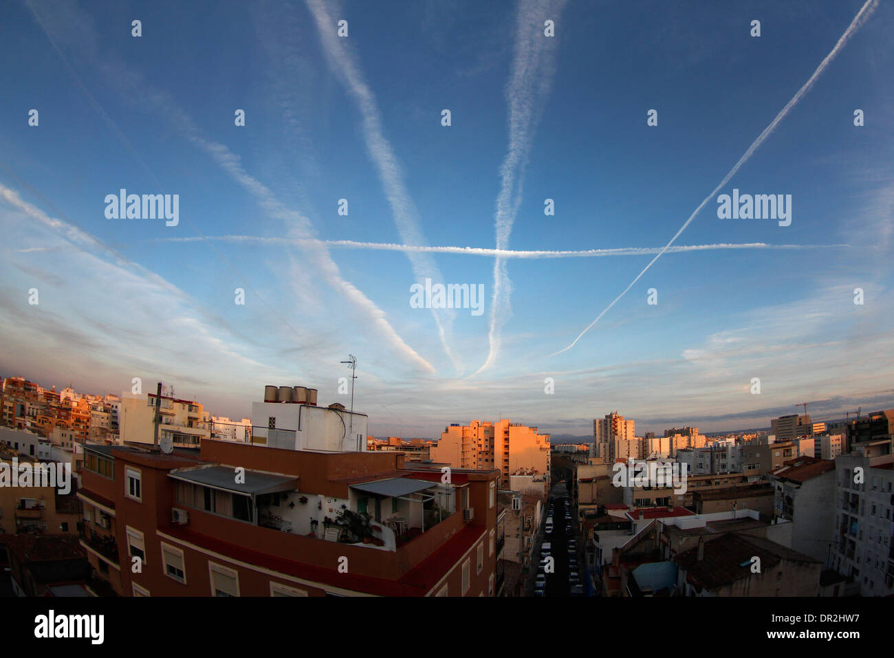 Chemtrails and contrails seen on Palma de Mallorca sky, Spain. Stock Photo