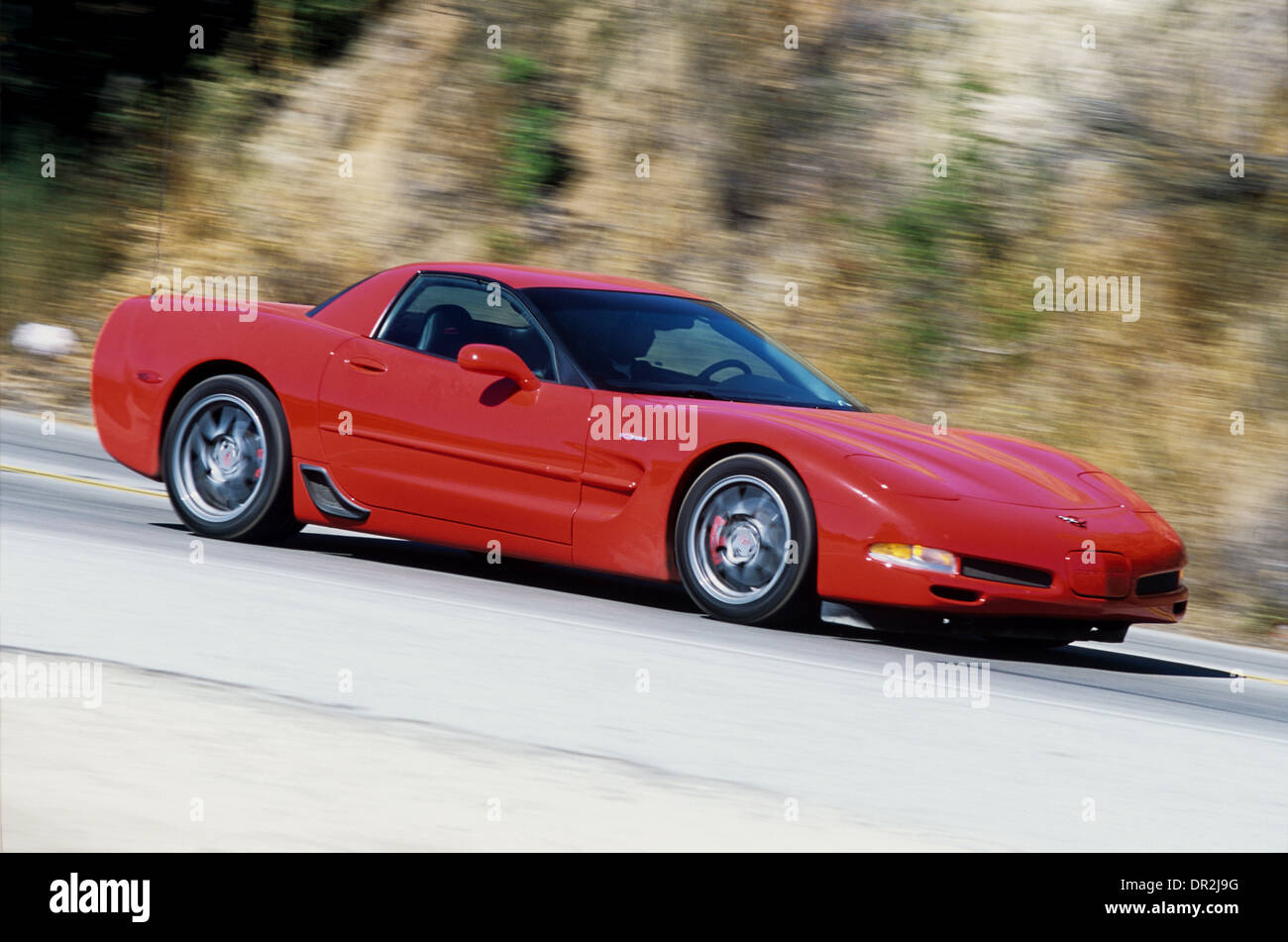 Chevrolet Corvette C5 - Z06 Model 2001 - Red - Front and side view - action driving shot Stock Photo