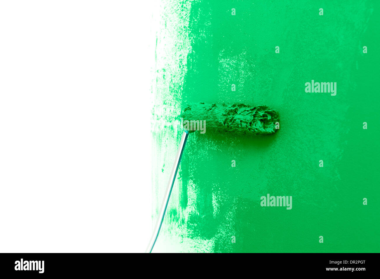 Paint a wall with roller green color Stock Photo Alamy