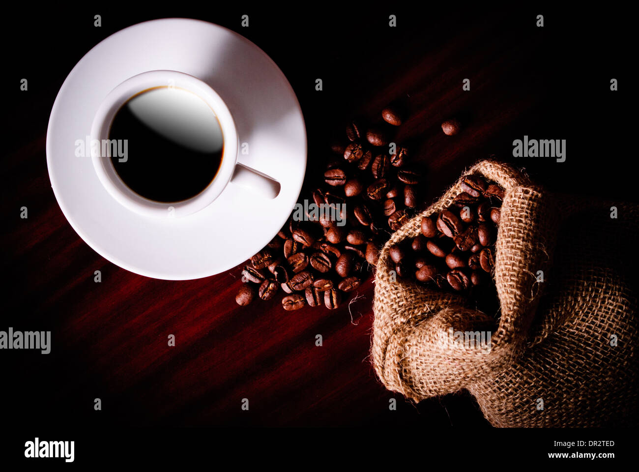 Coffee still life with cup, coffee beans in bag and sugar Stock Photo