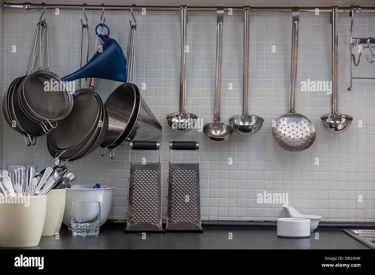 Some utensil on the kitchen wall Stock Photo