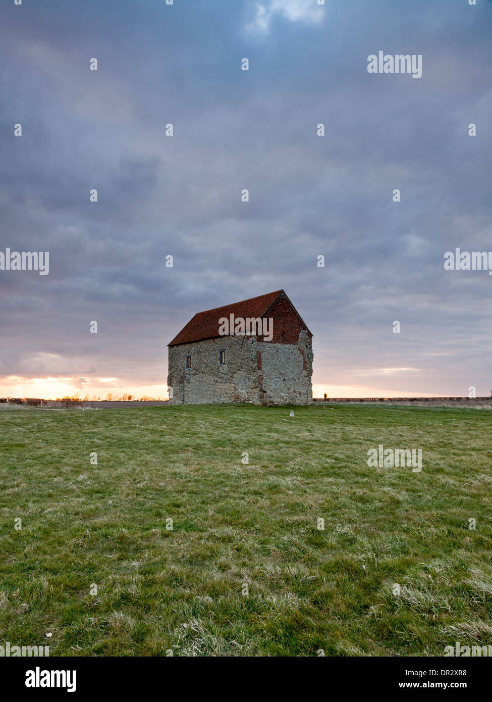 The chapel of St Peter on the Wall in Essex at sunset Stock Photo