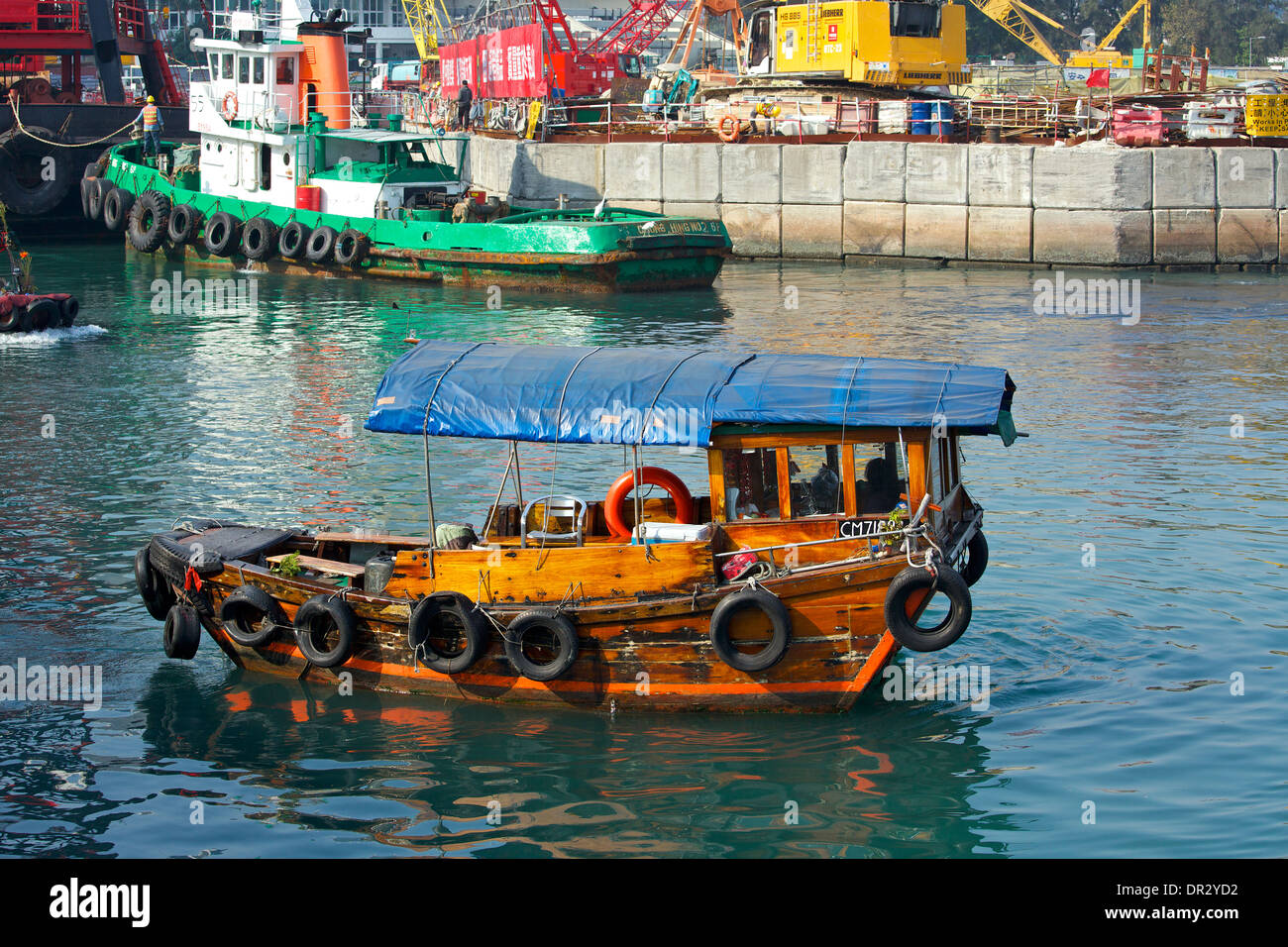 Sampan On The Construction Site of the Central-Wan Chai Bypass in the Causeway Bay Typhoon Shelter, Hong Kong. Stock Photo