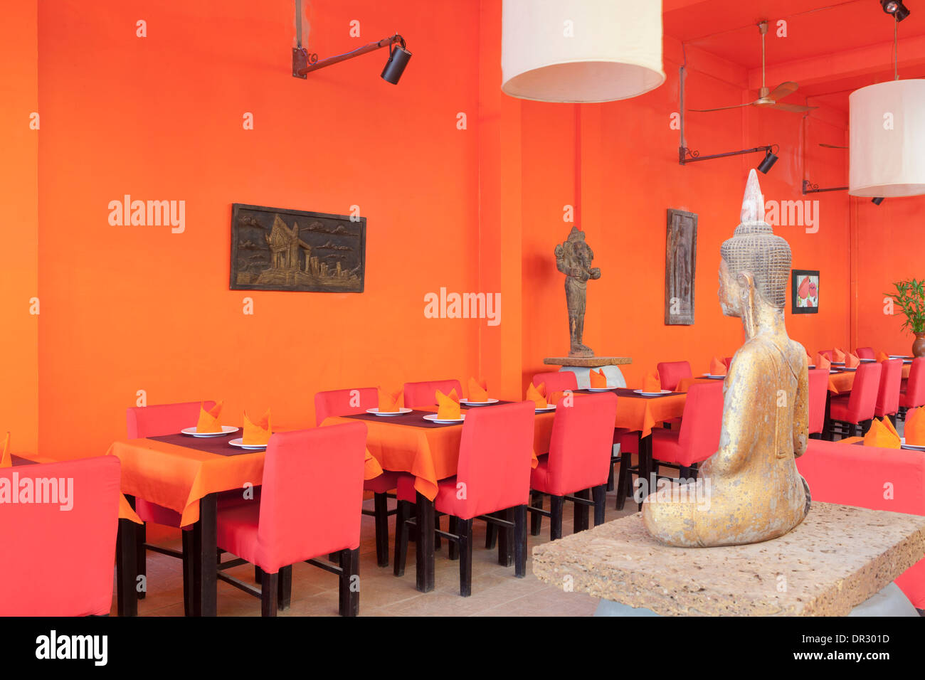 Colouful restaurant interior with Buddha images in Siem Reap, Cambodia Stock Photo