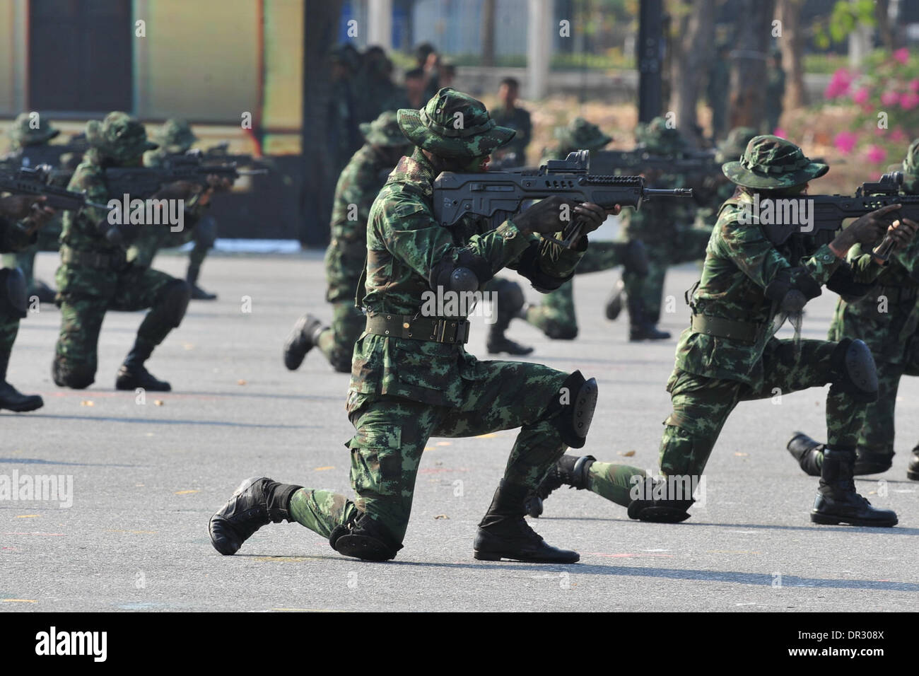 Bangkok, Thailand. 18th Jan, 2014. Thai soldiers participate in a training during celebrations of the Royal Thai Armed Forces Day at a military base in Bangkok, Thailand, Jan. 18, 2014. Credit:  Rachen Sageamsak/Xinhua/Alamy Live News Stock Photo