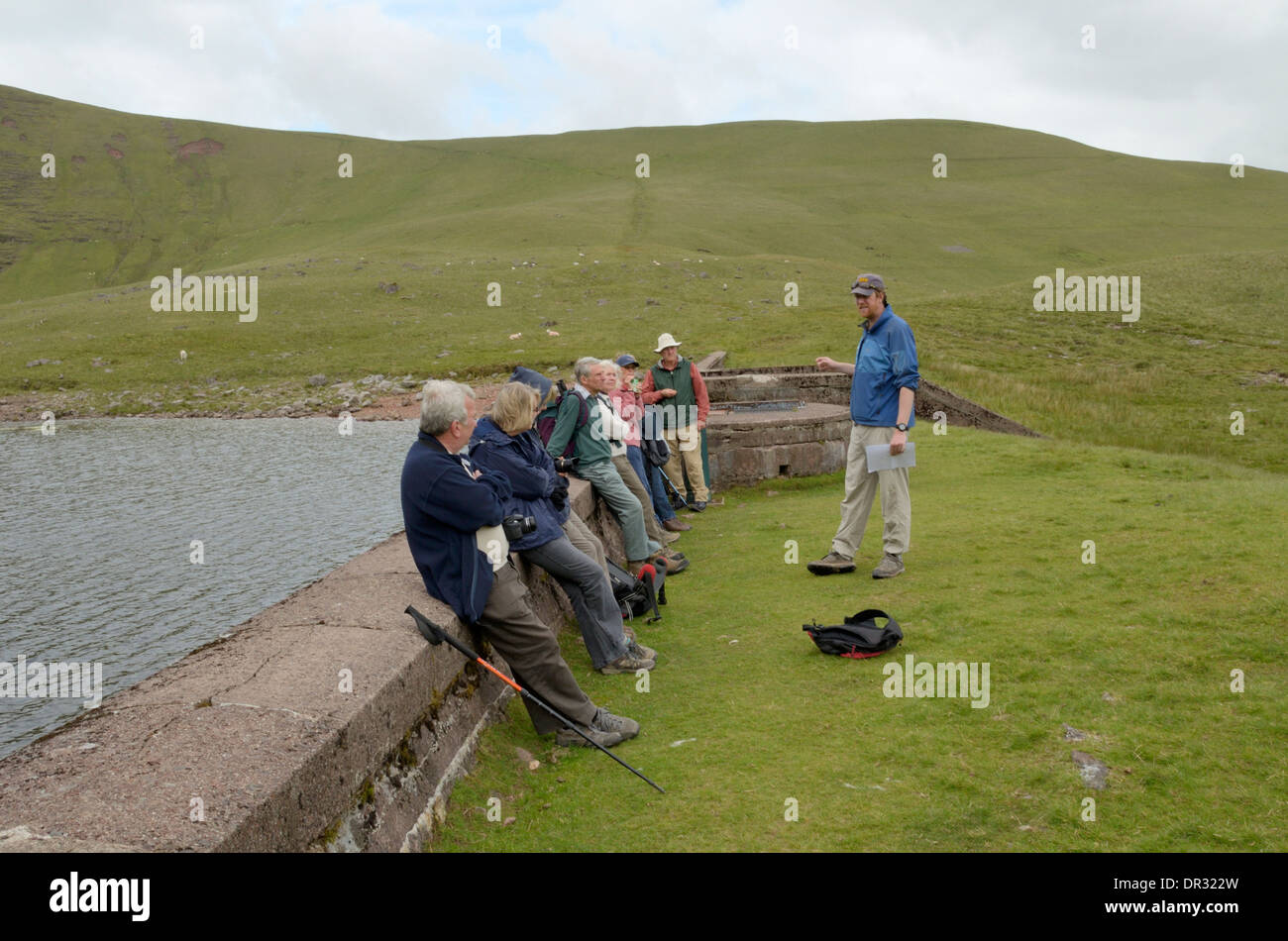 Group at Llyn y Fan Fach with leader talking Stock Photo