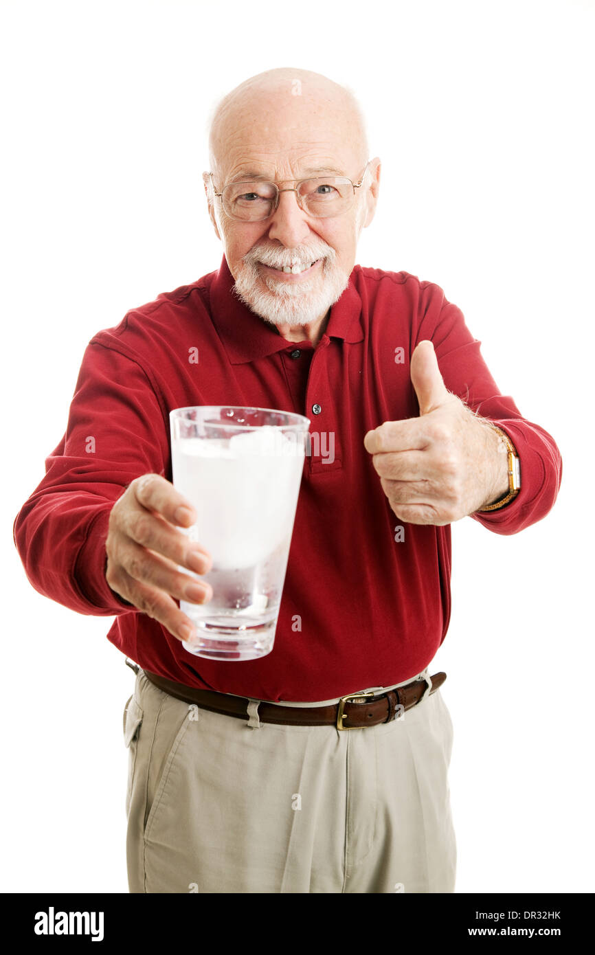 Handsome senior man holding a glass of ice water and giving a thumbs up ...