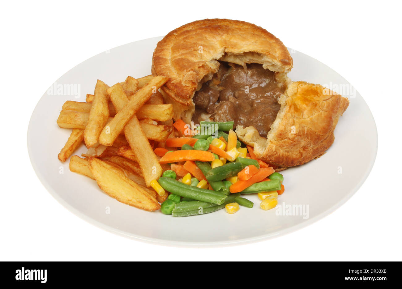 Steak pie chips and mixed vegetables on a plate isolated against white Stock Photo