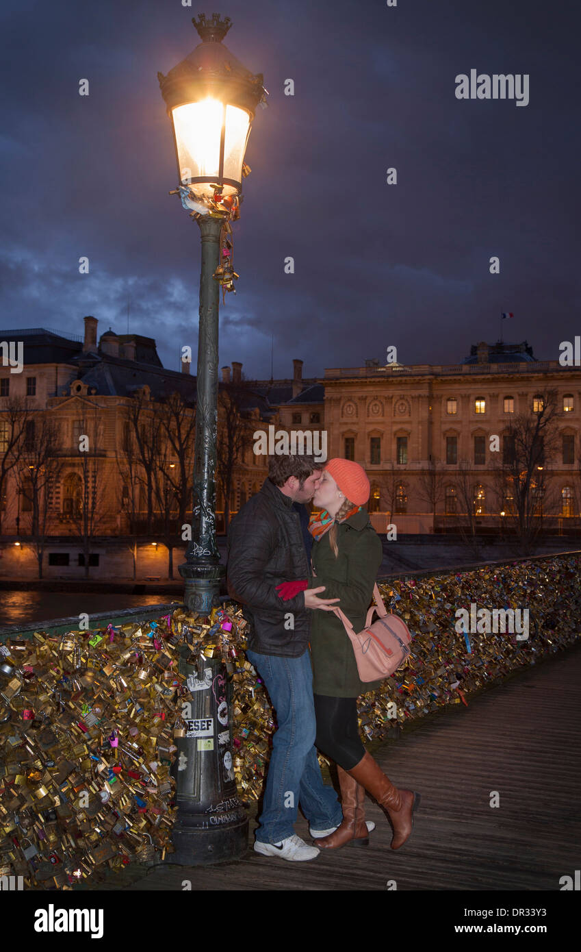 Romantic couple in paris kissing hires