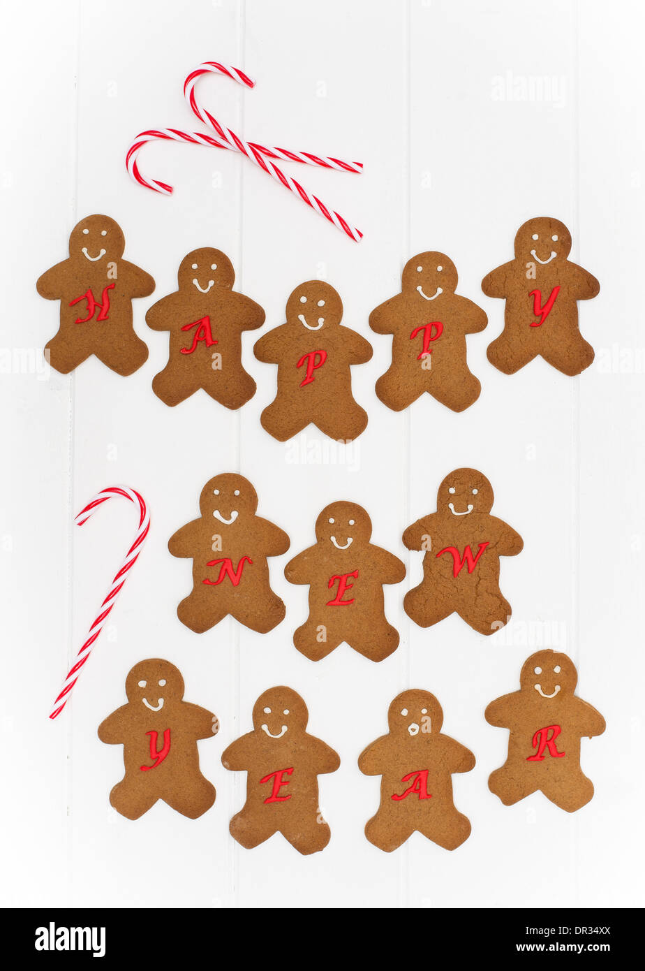 Homemade festive gingerbread men for the New Year on a white background Stock Photo