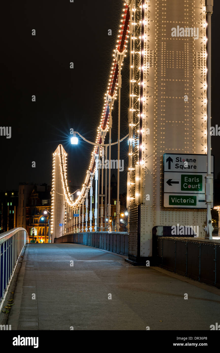 Chelsea Bridge, West London, a road traffic bridge spanning the River Thames, at night, lit up Stock Photo