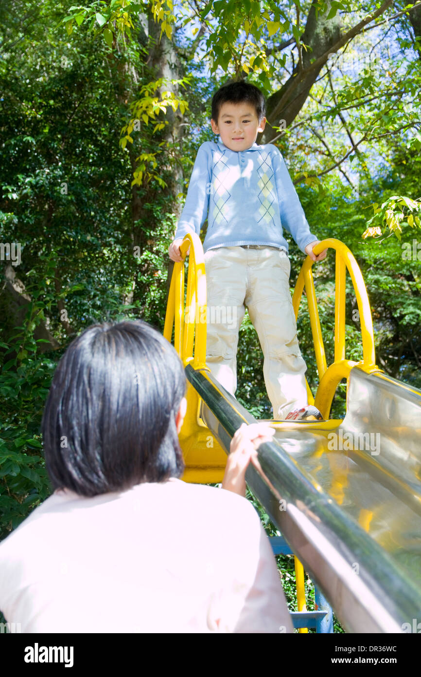 Mother and son playing in playground Stock Photo - Alamy