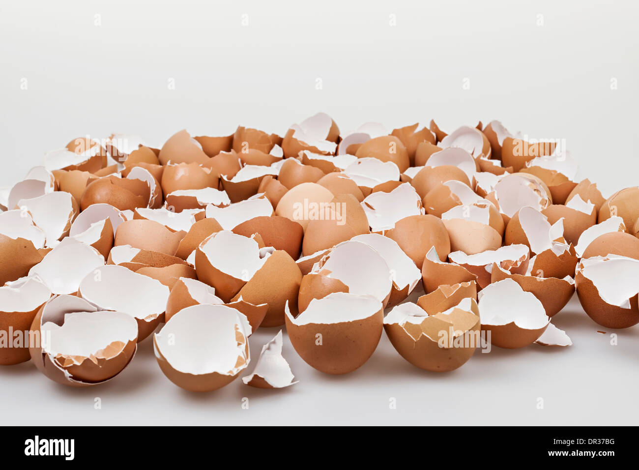Pile of many broken brown empty eggshells Stock Photo