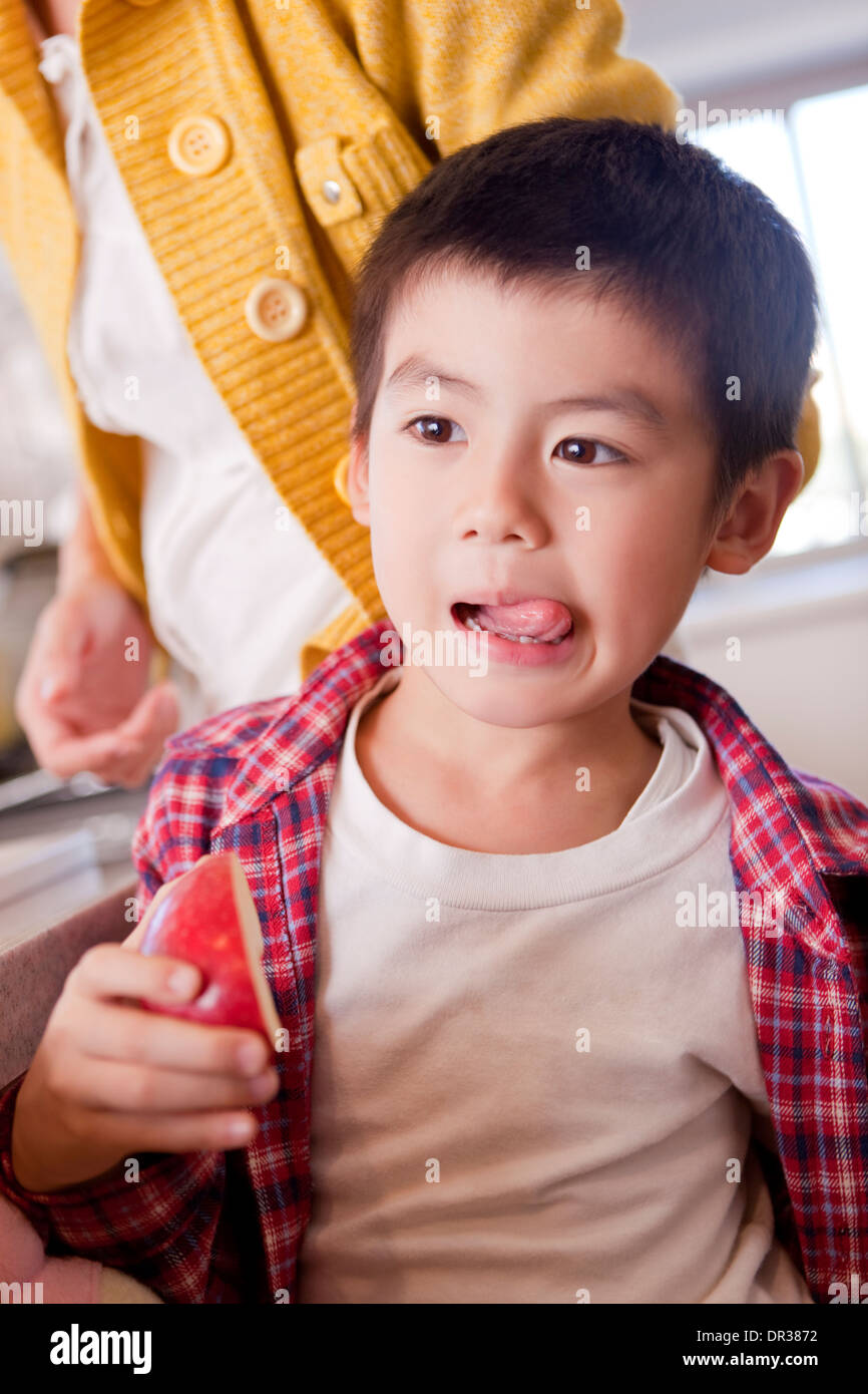 Mother and son eating apple Stock Photo Alamy