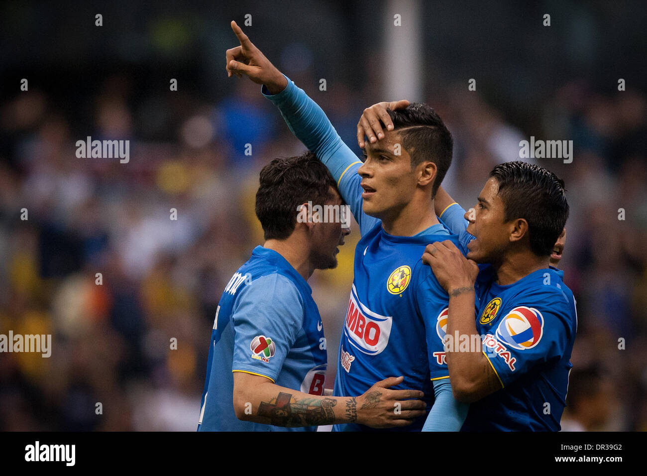 Mexico City, Mexico. 19th Jan, 2014. America's Raul Jimenez (C) celebrates after scoring during the match of the MX League Closing Tournament 2014, against Leon, in Mexico City, capital of Mexico, on Jan. 18, 2014. Credit:  Pedro Mera/Xinhua/Alamy Live News Stock Photo