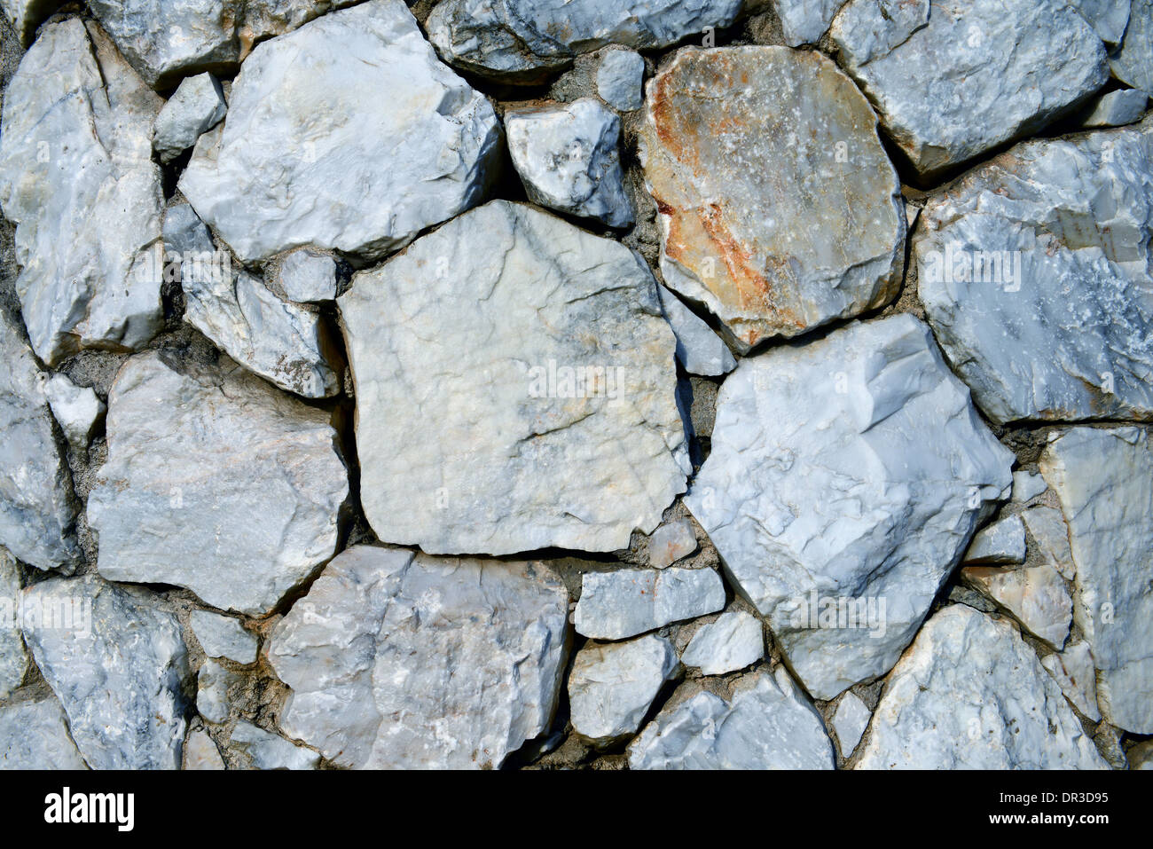 Closeup of stone wall background and texture Stock Photo - Alamy