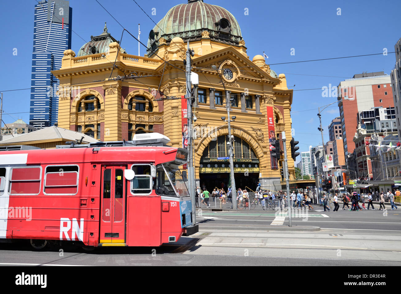 A Melbourne Tram passes Flinders Street Station in Melbourne, Victoria, Australia. Stock Photo