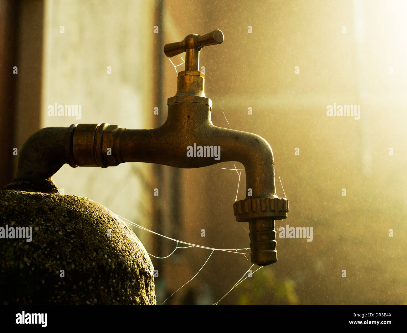 Beautiful January morning - old tap with cobwebs. Rustic, rural idyll. Stock Photo