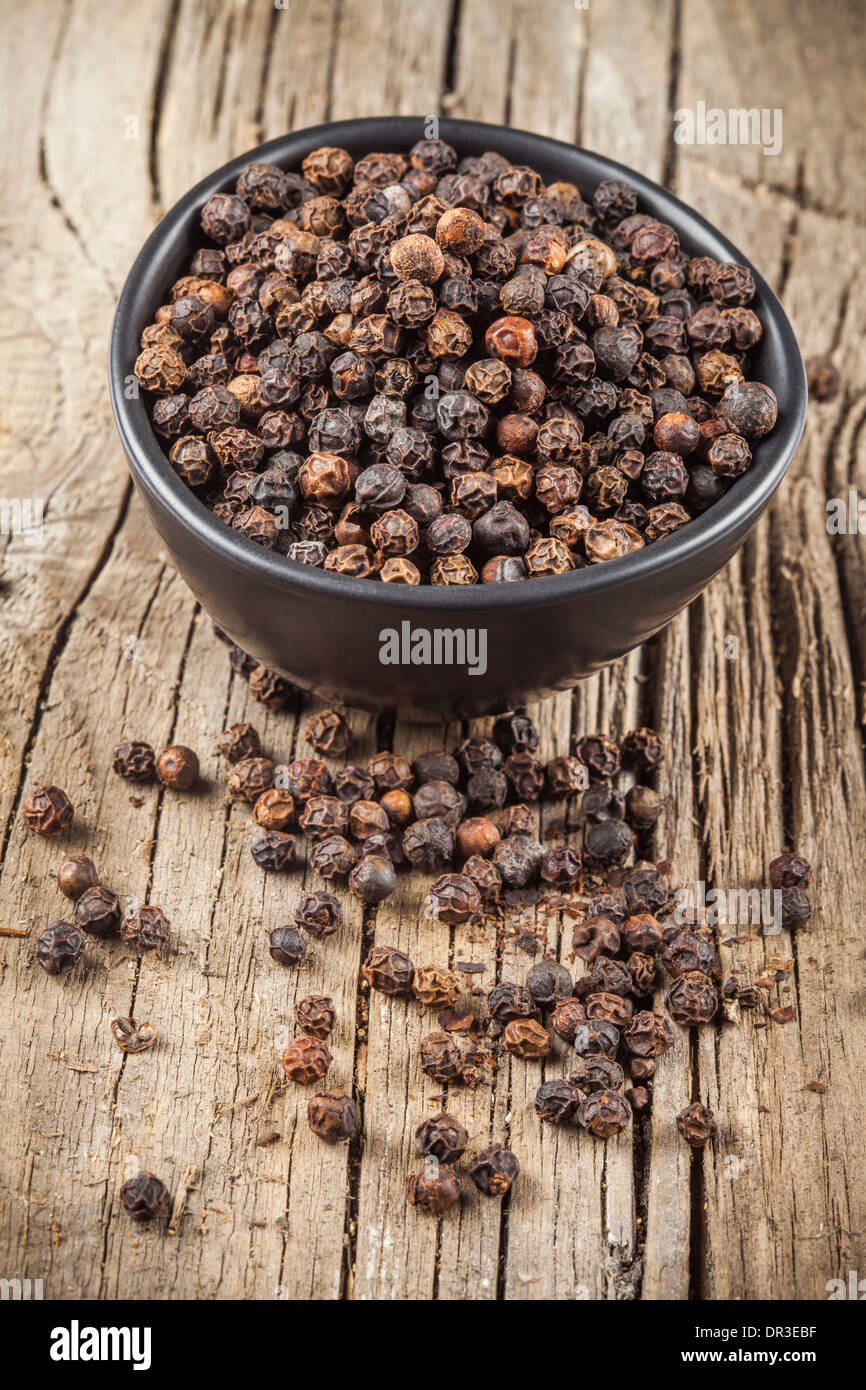 Black pepper spice in black bowl Stock Photo Alamy