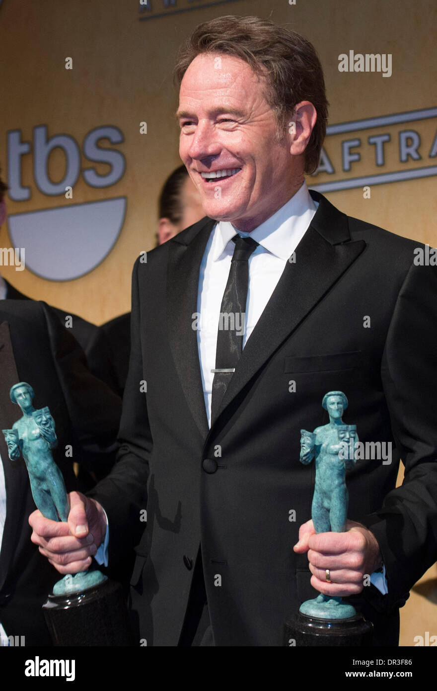 Los Angeles, USA. 19th Jan, 2014. Bryan Cranston, winner of the Outstanding Performance By An Ensemble In A Drama Series award for 'Breaking Bad', poses in the press room during the 20th Annual Screen Actors Guild Awards, at the Shrine Auditorium in Los Angeles, California, the United States, Jan. 18, 2014. Credit:  Yang Lei/Xinhua/Alamy Live News Stock Photo