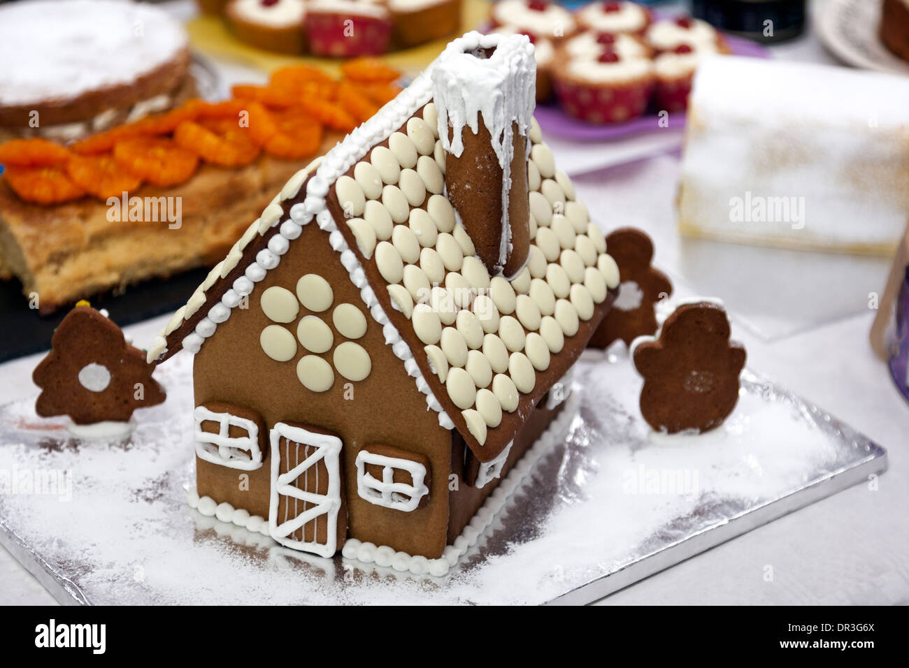 Traditional gingerbread house decorated with icing and white chocolate Stock Photo