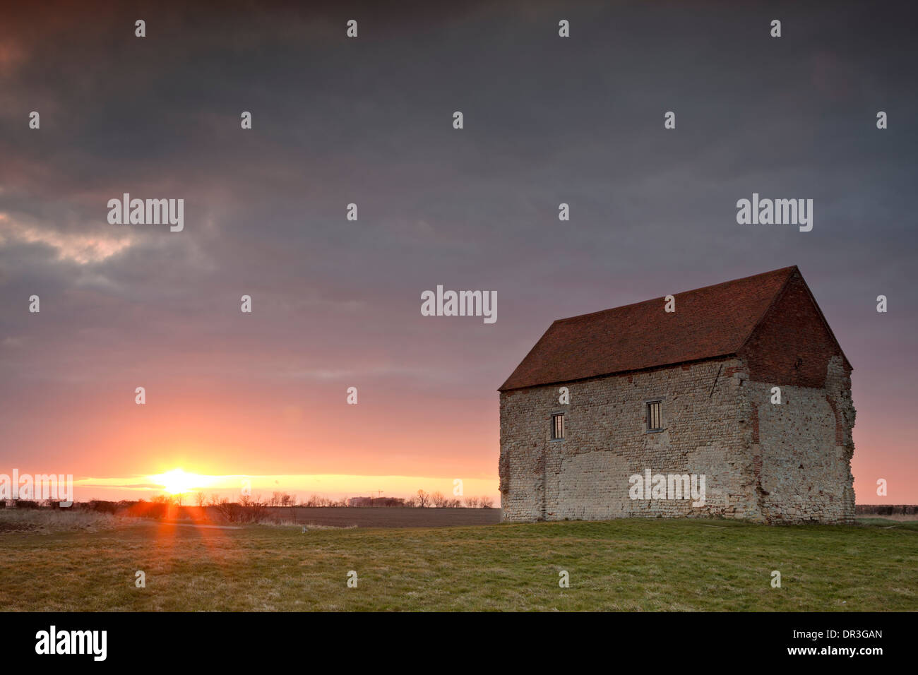 The chapel of St Peter on the Wall in Essex at sunset Stock Photo