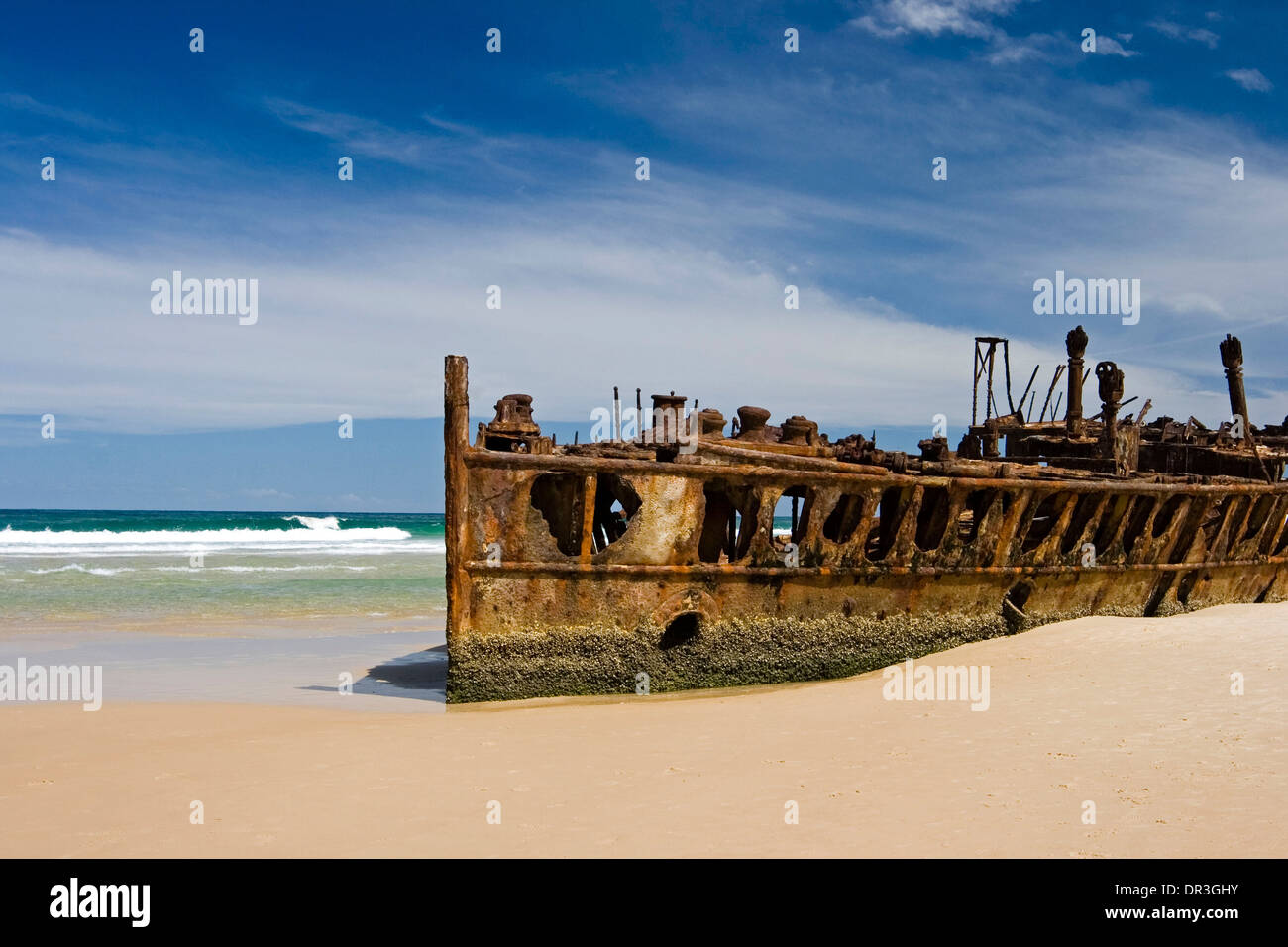Rusting remains of the luxury liner Maheno wrecked on beach at Fraser Island Queensland Australia Stock Photo