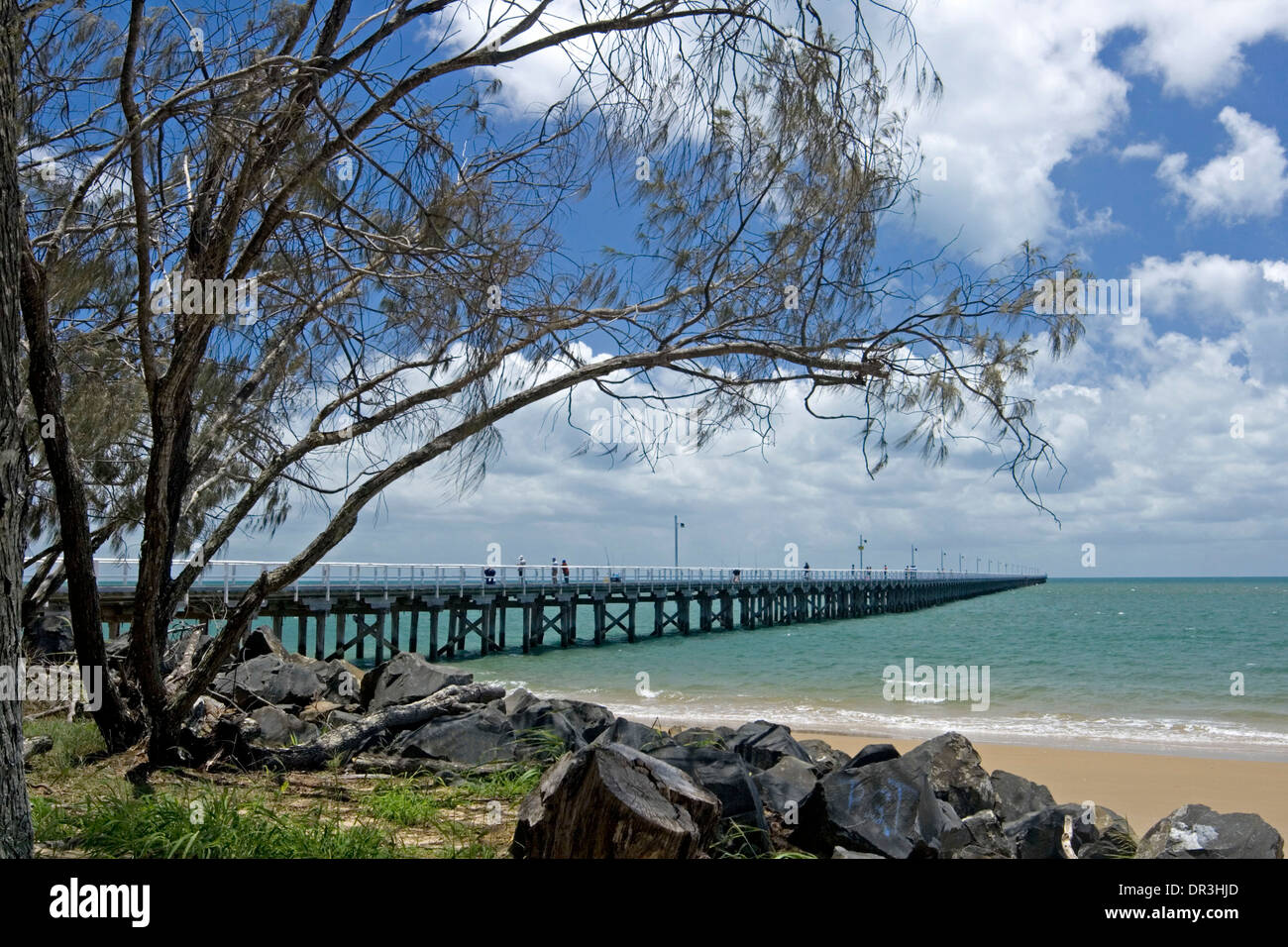 Coastal landscape at Hervey Bay, Queensland Australia , with historic Urangan pier,  beach and turquoise ocean under blue sky Stock Photo