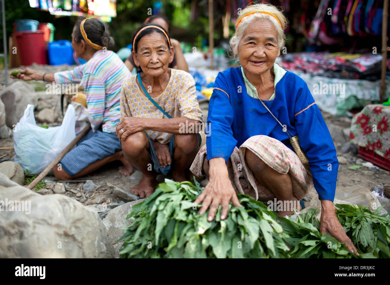 Hanunoo Mangyan women selling their crops at a Mangyan market near