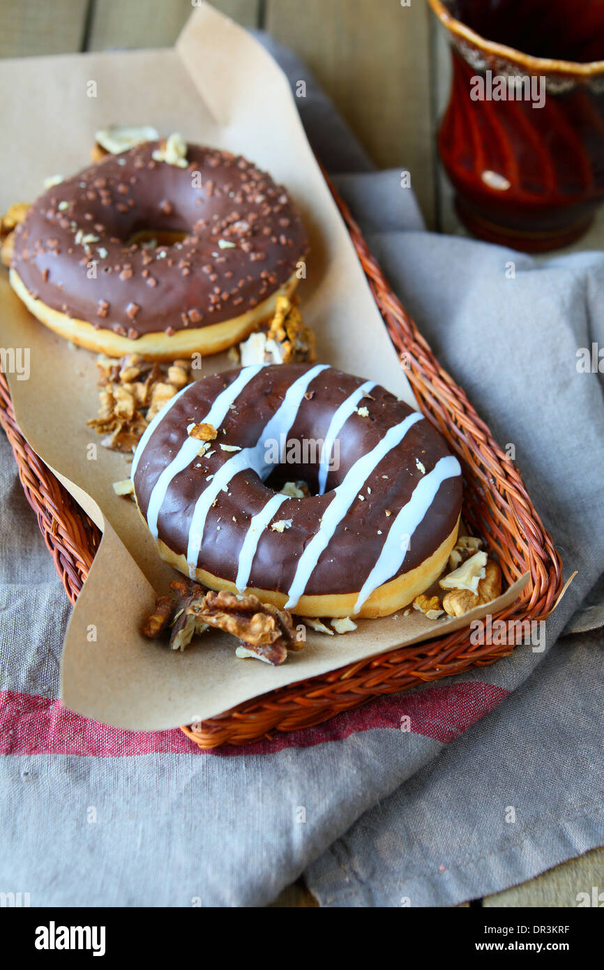 walnut donuts with chocolate frosting, food closeup Stock Photo