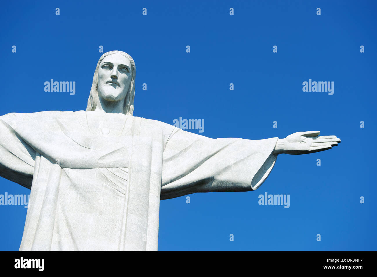 Corcovado Christ the Redeemer stands in blue sky in Rio de Janeiro Brazil Stock Photo