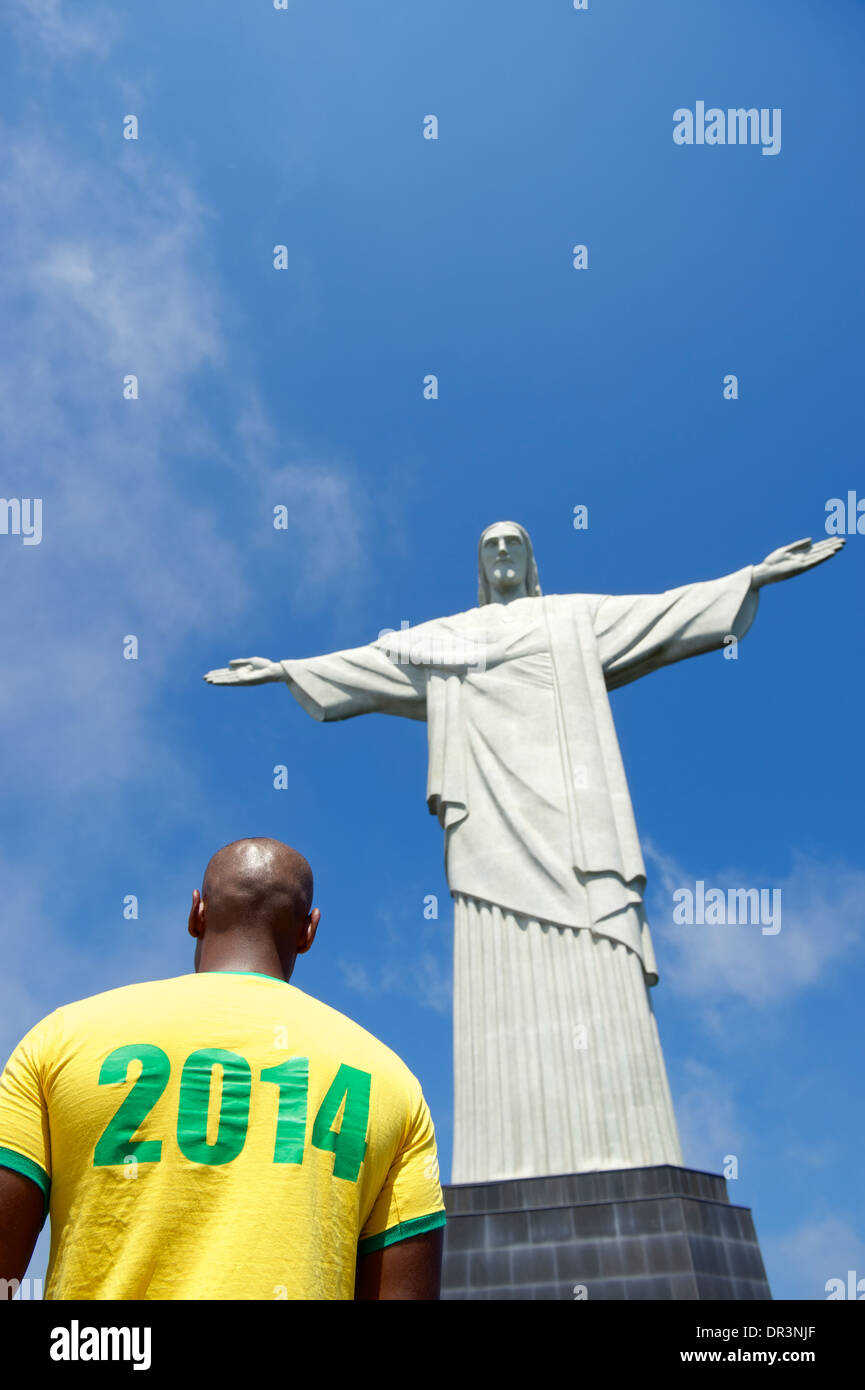 Brazilian football soccer player in 2014 shirt at Corcovado Cristo Redentor Rio de Janeiro Stock Photo