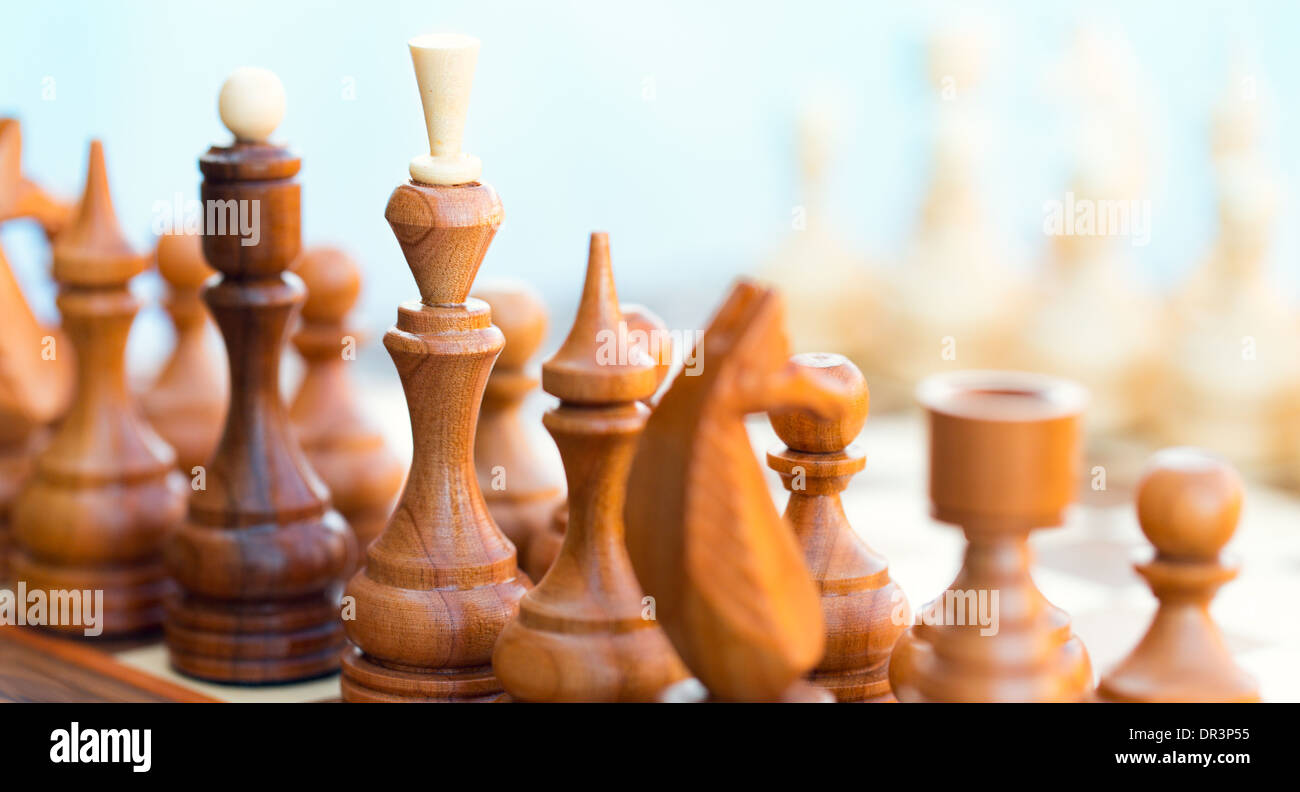 Chess pieces on the board. Focus on King Stock Photo