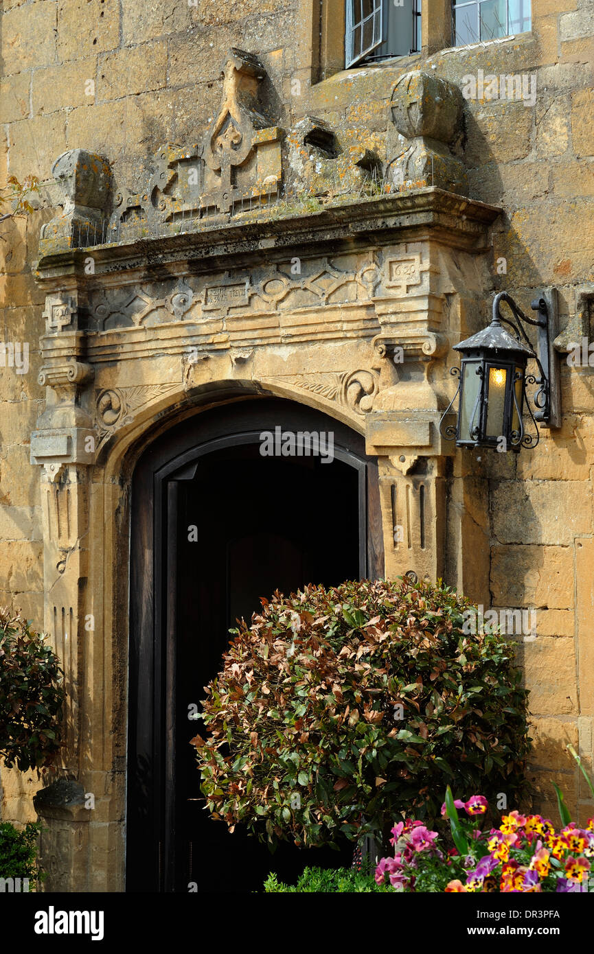 Medieval carved stone doorway, Lygon Arms Hotel, High Street, Broadway, The Cotswolds, Worcestershire, England, United Kingdom, Stock Photo