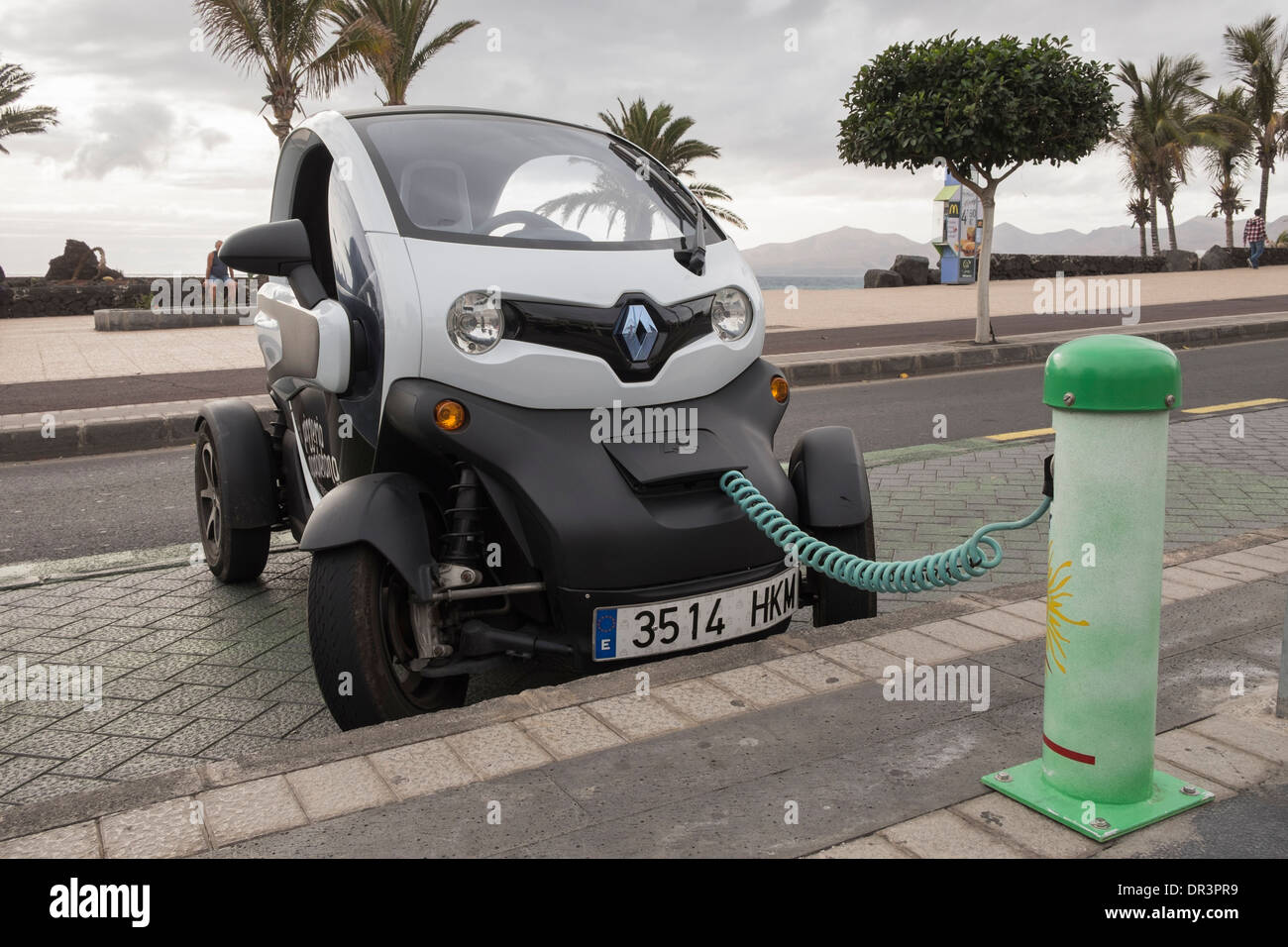 renault-twizy-battery-powered-electric-car-plugged-in-to-a-sol-lar