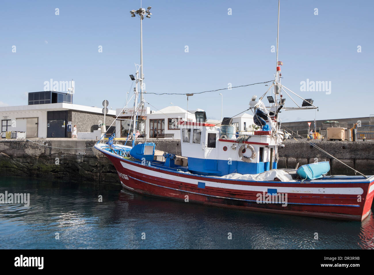 Traditional red fishing boat in the port of Puerto del Carmen, Lanzarote, Canary Islands, Spain Stock Photo