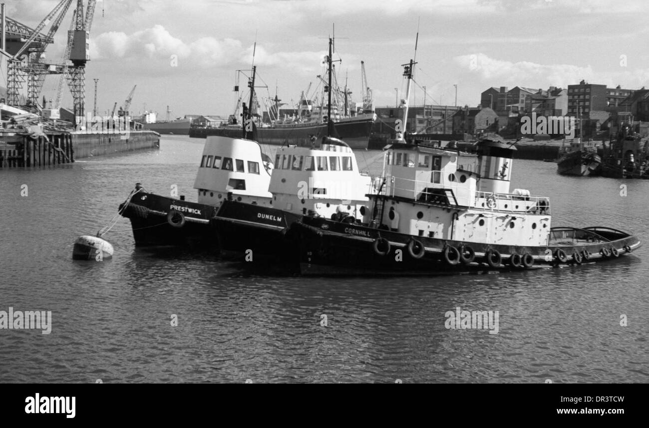 Tugboats Prestwick,  Dunelm and  Cornhill  moored in the river Wear Sunderland circa 1970, north east England, UK Stock Photo