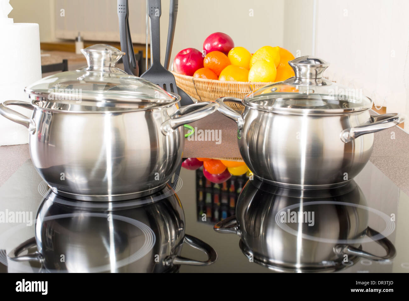 ceramic hob with pans in the kitchen Stock Photo Alamy