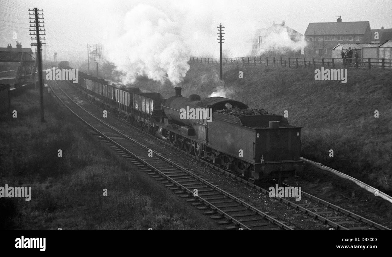 British Railways Q6 0-8-0 steam locomotive passing Boldon Colliery towards Tyne Dock north east England 1967 Stock Photo