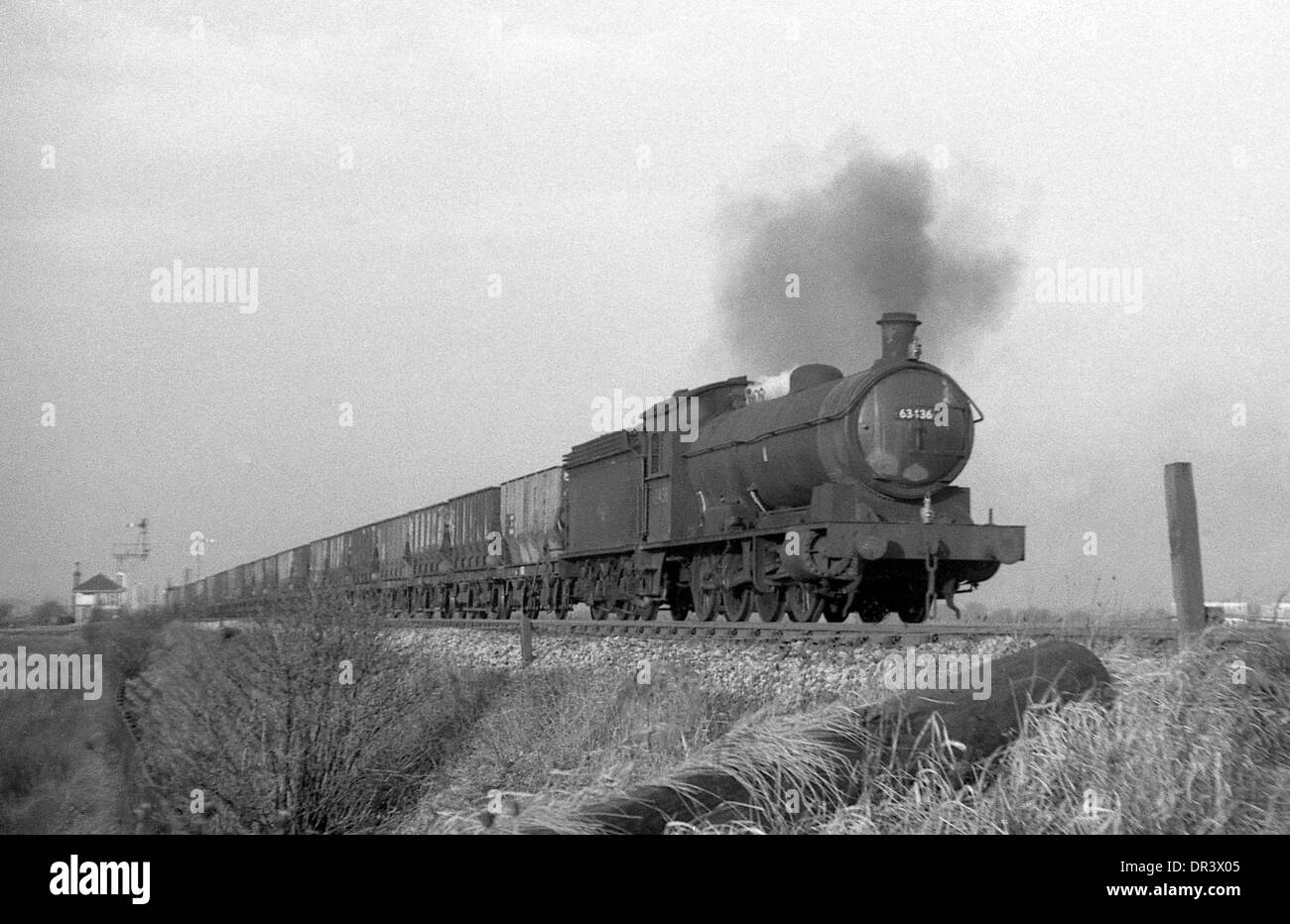 British Railways steam locomotive Q6  0-8-0 63436 approaches Tile Shed crossing, Boldon north east England 1967 Stock Photo
