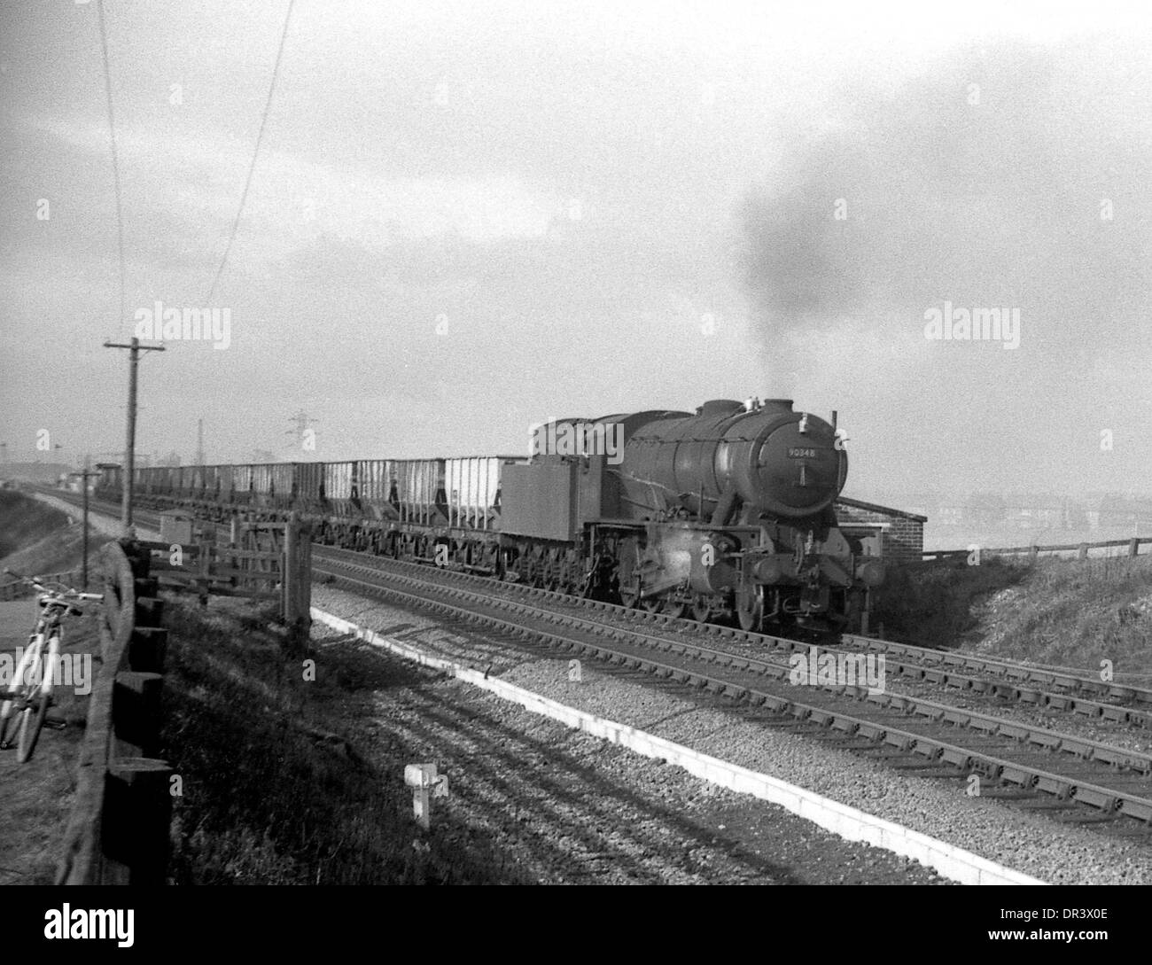 British Railways steam locomotive WD 2-8-0 90348 approaches Boldon Colliery station, north east England 1967 Stock Photo