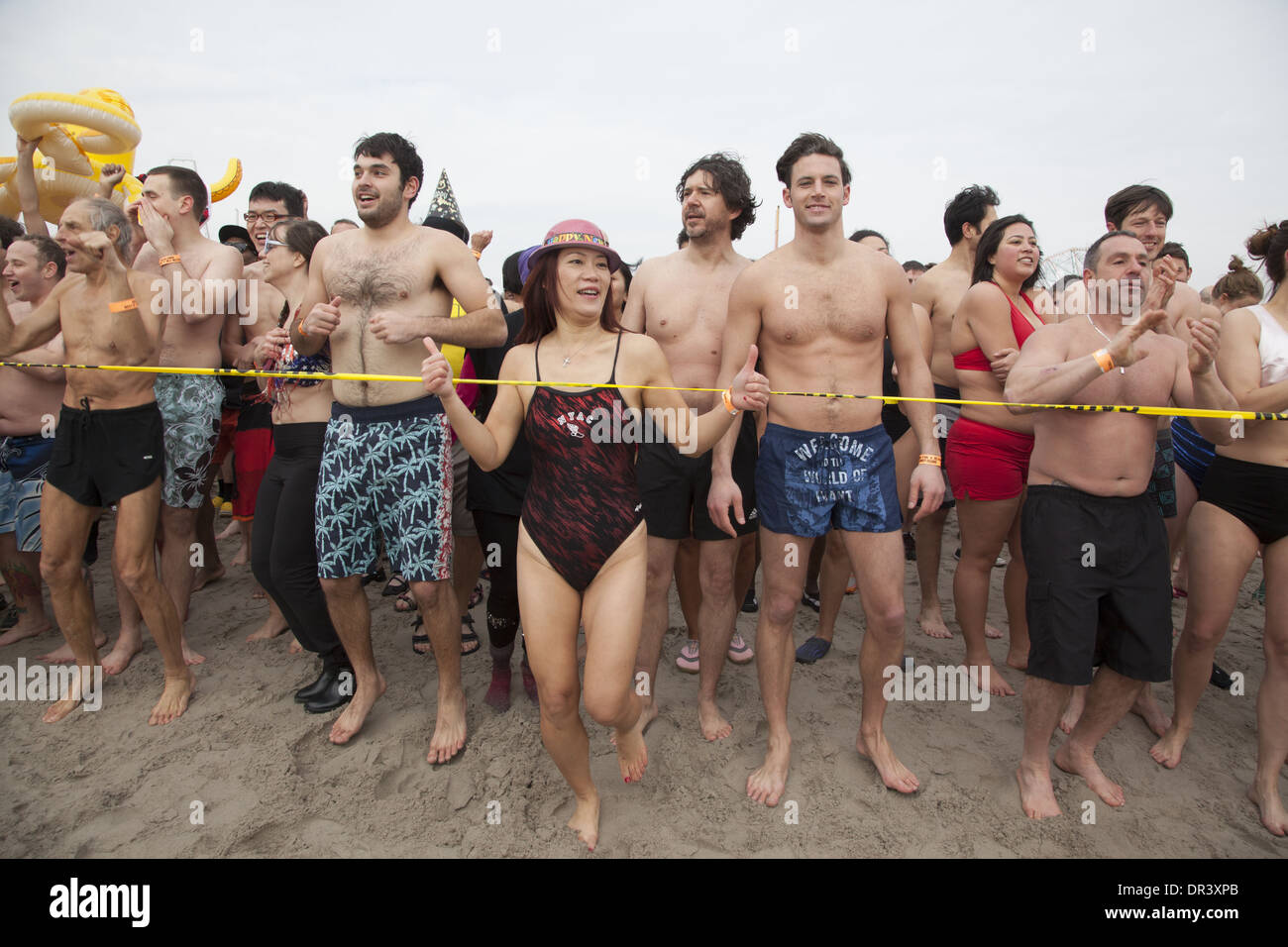 All sorts of people came out for the annual Polar Bear Club New Years Day 2014 plunge into the icy Atlantic at Coney Island. Stock Photo